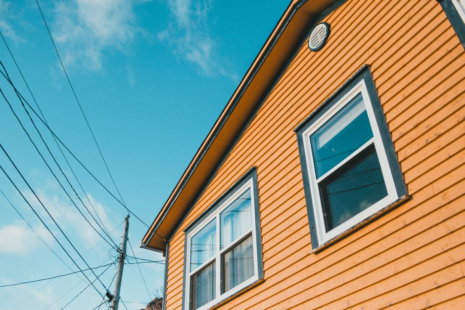 Painted house exterior with a coated wall and trim